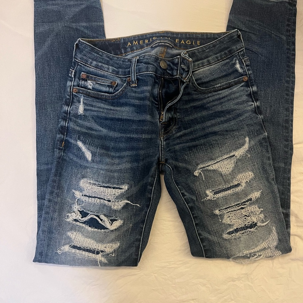American eagle air flex blue skinny torn jeans